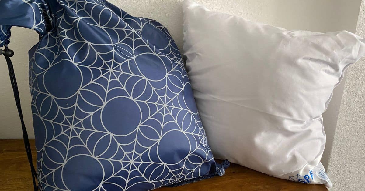 The pillows arrived in a dark-blue drawstring bag with cobweb motifs matching the nanoSPACE design. The package included information on how the anti-dust mite pillow without zip works, what it's made of, and how to care for it.